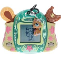 an electronic toy with a little dog on it's face and keychain