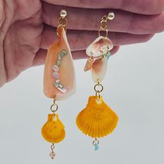 All seashell earrings are hypoallergenic and handmade. This pair features natural seashells, abalone chips, and gold-plated findings.  The ear post is 14K gold-plated    🐚Natural seashells from the ocean 🌊  ✨ Non-tarnish, hypoallergenic gold-plated findings  👂Great for sensitive ears 💛Nickel and lead-free 🫶🏼Crafted slowly and with love. Perfect for a unique gift for a loved one.  - Our Products - We work with high-quality, natural materials that stand the test of time. Since each piece is handmade with natural materials such as freshwater pearls, stone beads, and seashells, no jewelry is completely alike. Color, shape, and size of shells and beads will look slightly different in each piece. - Materials -  Stainless Steel (When Possible) Our jewelry is made from stainless steel with a Dangle Shell Earrings Gift, Shell Dangle Earrings, Handmade Shell Dangle Earrings, Handmade Shell Drop Earrings, Handmade Dangle Shell Earrings, Bohemian Dangle Shell Earrings, Adjustable Shell Earrings With Ocean-inspired Style, Handmade Ocean-inspired Dangle Shell, Ocean-inspired Shell-shaped Earrings For Gifts