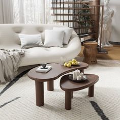 a living room filled with furniture and a spiral staircase