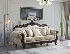 a living room filled with furniture and a chandelier