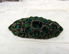 "Vintage \"L/N\" marked - Little Nemo - molded pot metal and two-tone green rhinestone brooch. All the stones are intact and very sparkly and the clasp is secure." Antique Green Brooch For Evening, Formal Green Rhinestone Brooches, Vintage Green Rhinestone Brooches, Green Vintage Rhinestone Brooches, Vintage Green Rhinestone Brooch, Rhinestone Bracelet, Rhinestone Brooches, Blue Rhinestones, Small Gifts