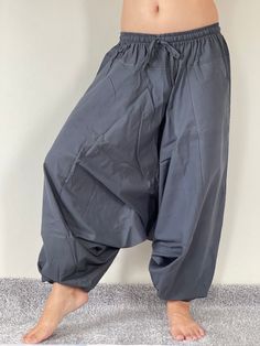 "Harem Pants Ethically Made in Thailand, Low crotch yoga pant, Unisex harem pants, Gorgeous Harem Pants, Lounge & Yoga Trousers Thai Cotton harem pants have the \"flow\", perfect for yoga or just a cool strolling. Comfort and character are what these pants are all about. They have the traditional sarong look & feel but a lot more practical when it comes to activities like yoga. As a bonus, they are convertible! Just pull them up and you get yourself a cute jumpsuit in a flash. Together w Yoga Harem Pants With Drop Crotch, Yoga Harem Pants With Drop Crotch And Relaxed Fit, Baggy Ankle-length Harem Yoga Pants, Relaxed Fit Harem Yoga Pants, Relaxed Fit Drop Crotch Harem Pants For Yoga, Stretch Harem Pants For Yoga, Ankle-length, Relaxed Fit Ankle-length Harem Pants For Yoga, Stretch Ankle-length Harem Pants For Yoga, Relaxed Fit Hip-length Yoga Pants