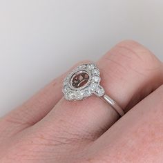 This classic ring design setting has a natural earth mined diamond halo and milgrain detail with a tapered shank. A bezel setting in a floral inspired design perfect for any round center stone of your choice! This ring setting is made with solid 14K Gold and natural Earth mined SI / G-H diamonds. Classic Halo Ring In White Gold With Bezel Setting, Classic Halo Ring With Bezel Setting In White Gold, Classic White Gold Halo Ring With Bezel Setting, Elegant Halo Ring With Bezel Setting, Classic Rings With Halo And Round Stone, Diamond Halo Ring With Bezel Setting, Promise Ring With Round Cut Halo And Bezel Setting, Promise Ring Halo With Bezel Setting And Round Cut, Classic Round Halo Ring With Bezel Setting