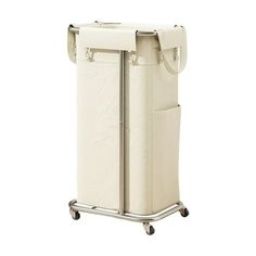 a large white laundry hamper on wheels