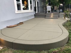 a concrete patio in front of a house