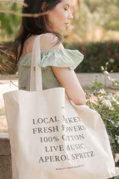 For those who love the simple things in life and enjoy them in style. This sophisticated shopper tote is made with 100% cotton and features a classic graphic describing the perfect summer aesthetic. It's perfect for trips to the farmer's market, shopping, day trips, beach days, picnicks, gifts, overnights, and your lovely summer activites. Stock is limited so follow the link and get your summer aesthetic. Trendy Spring Canvas Bag With Letter Print, Trendy Letter Print Canvas Bag For Spring, Spring Tote Shoulder Bag With Letter Print, Everyday Spring Bags With Letter Print, Trendy Canvas Bag For Everyday Spring Use, Spring Everyday Bags With Letter Print, Spring Letter Print Tote Shoulder Bag, Letter Print Travel Bags For Spring, Summer Canvas Shoulder Bag For Everyday