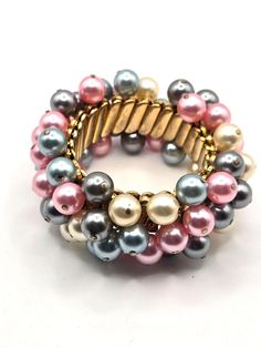 Gold color Stretch Pearl Bracelet Signed Empire Made.  Vintage with multiple faux pearls in blue grey pink and cream. Will fit most wrists.  Very pretty and in good shape. Please see my other items for more great vintage finds. Pearl Bracelet, Vintage Finds, Arm Band, Faux Pearl, Blue Grey, Gold Color, Jewelry Bracelets, Accessory Gift, Beaded Bracelets