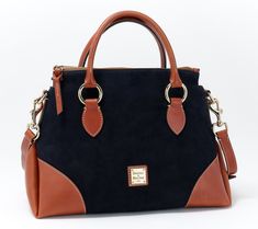 The best of both worlds, this sturdy suede satchel features luxe Florentine leather trim. With a structured silhouette and timeless touches (like a double-handle design with rich, goldtone hardware, this bag has everything you need and then some. From Dooney & Bourke. Formal Suede Bags With Detachable Handle, Formal Suede Bag With Top Handle, Formal Fall Satchel With Leather Handles, Suede Top Handle Bag For Formal Occasions, Formal Suede Top Handle Bag, Classic Bags With Suede Lining And Double Handle, Suede Tote Bag With Gold-tone Hardware, Luxury Fall Satchel With Gold-tone Hardware, Suede Bags With Gold-tone Hardware And Top Handle