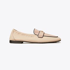 Our Ballet Loafer® is an interpretation of two classics — the flexibility of a ballet slipper with the profile of a loafer. The insole provides performance-level comfort, ruched sides secure the foot and treads on the outsole add traction. It is crafted in leather and detailed with a Double T in brushed gold. The shoe's edges are hand-painted and the strap is hand-stitched. Slip-on Flat Loafers With Cushioned Footbed, Classic Beige Slip-on Ballet Flats, Classic Slip-on Leather Shoes For Spring, Classic Beige Slip-ons For Fall, Classic Slip-on Ballet Flats With Textured Sole, Slip-on Loafers With Textured Sole And Flat Heel, Beige Leather Sole Slip-on Ballet Flats, Slip-on Ballet Flats With Textured Sole, Cushioned Almond Toe Ballet Flats For Work