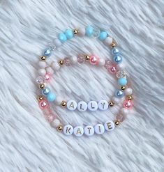 the personalized bracelet with beads and charms is shown on a white furnishing