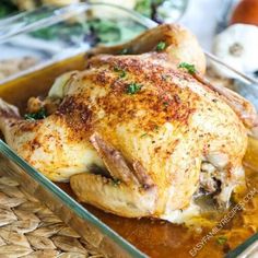 a close up of a chicken in a glass dish