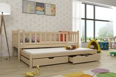 a child's bedroom with a wooden bed and toy storage bins on the floor