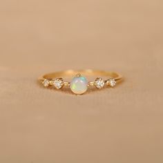 Crafted with 14k Solid Gold, this ring are not only stylish but also lightweight. You can wear this ring all day easily. Four prong set natural Ethiopian opal & diamond ring for women. Handmade jewelry, Wedding ring, Stackable ring, Anniversary ring. You can gift them on Anniversary, Birthday and Christmas. Also available in Rose Gold, White Gold and Yellow Gold. 𝐏𝐫𝐨𝐝𝐮𝐜𝐭 𝐢𝐧𝐟𝐨: 𝟏𝟒𝐤 𝐬𝐨𝐥𝐢𝐝 𝐠𝐨𝐥𝐝 ★𝐃𝐞𝐭𝐚𝐢𝐥𝐬 ★𝐒𝐊𝐔 𝐂𝐨𝐝 : 1040 ★𝐏𝐮𝐫𝐢𝐭𝐲 : Solid 14k Gold ( Also availa Opal Rings Engagement, Opal Diamond Engagement Ring, White Opal Engagement Ring, October Birthstone Ring, Opal Diamond Ring, October Birthstone Rings, Engagement Rings Opal, Man Den, Ring Minimalist