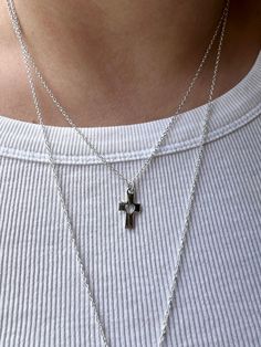 Embrace the timeless elegance and spiritual significance of our small silver cross  necklace. Meticulously crafted for both style and sentiment, this dainty necklace is the perfect accessory for everyday wear or special occasions. Product Features: 🌟Elegant Design: The cross pendant, a universal symbol of faith and hope, is elegantly crafted in high-quality plated sterling silver. The sleek and minimalist design ensures it complements any outfit, from casual to formal. 🌟 Perfect Length: The pendant is suspended on an 18'' sterling silver chain, providing a flattering length that sits gracefully on the collarbone. This versatile length is ideal for layering with other necklaces or wearing on its own. 🌟 Quality Material: Made from sterling silver plated chain, this necklace is hypoallerge Sterling Silver Crucifix Cross Necklace With Adjustable Chain, Silver Necklace With Delicate Chain And Cross Pendant, Silver Minimalist Cross Necklace With Clavicle Chain, Silver Cross Necklace With Delicate Chain, Everyday Cross Charm Necklace With Adjustable Chain, Silver Crucifix Necklace For Everyday, Everyday Silver Crucifix Jewelry, Silver Crucifix Jewelry For Everyday Wear, Minimalist Hypoallergenic Cross Jewelry