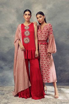 Transitional Dresses With Printed Motifs, Bohemian Sets With Embroidered Sleeves For Festive Occasions, Eid Dresses With Tassels, Eid Designer Dresses With Tassels, Designer Eid Dresses With Tassels, Festive Designer Dress With Back Tassel Tie-up, Festive Dresses With Embroidered Sleeves, Festive Dresses With Embroidered Sleeves For Festivals, Festive Designer Dresses With Tassels