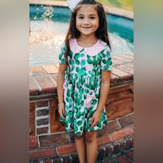 Girls Cactus Twirl Dress. Color Cactus Pattern With Pink Gingham Trim 95% Polyester, 5% Spandex Make Memories In Our Twirl Dress! Perfect For Fun Family Time, This Sweet Dress Is Sure To Bring A Smile To Your Face. Let Your Little One Twirl 'Til Her Heart's Content! Please Note Colors May Vary Slightly Due To Lighting And Different Monitors. Boutique Items May Or May Not Come With Tags. This Is A Brand New Boutique Item That Has Never Been Worn Or Washed. Color Cactus, Bee Dress, Cactus Pattern, Boutique Items, Twirl Dress, Make Memories, Pink Gingham, Fun Family, Sweet Dress