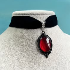 Material: agate    Style: Women    Shape: water drop    Color: red, black  Introducing our Gothic Red Pendant - a captivating and enchanting necklace that evokes the mysterious allure of the night. Crafted with meticulous attention to detail, this pendant features a deep red crystal that exudes a sense of elegance and intrigue. The Gothic design, reminiscent of vampire aesthetics, adds a touch of dark charm, making it a perfect accessory for those who embrace the mystique of the occult. Whether Gothic Bands, Vampire Necklace, Gothic Mode, Velvet Necklace, Moda Hip Hop, Velvet Choker Necklaces, Gothic Vampire, Red Pendants, Witch Jewelry