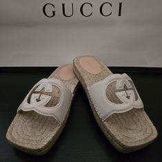 Gucci Interlocking G Cut-Out Espadrilles Highlights Cream White - Calf Leather Signature Interlocking G Logo Cut-Out Detailing " Open Toe Slip-On Style Braided Raffia Sole Composition Lining: Calf Leather 100%, Jute 100% Outer: Leather 100% Sole: Rubber 100% Brand New Gucci Open Toe Espadrilles For Vacation, White Casual Gucci Espadrilles, Gucci White Round Toe Espadrilles, White Gucci Espadrilles For Spring, Gucci Casual Espadrilles For Vacation, Casual Gucci Espadrilles For Vacation, Gucci Leather Beach Espadrilles, Gucci Leather Espadrilles For Beach, Designer White Espadrilles With Round Toe