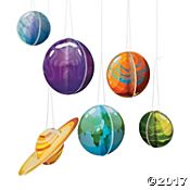 four colorful balls hanging from strings in the shape of planets