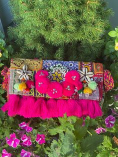 This colourful statement trendy bag is so gorgeous that you simple outfit will look outstanding.  This bag is handmade in india (jaipur). Every piece will be different because it's made with different fabric and textiles by hand not with machine. Each bag is bully lined , has a zipper inside and on top. Beautiful pompom and treads are attached to the purse.  Since these are handmade and made with vintage fabric and patches, there will be imperfections like broken shells which adds to the charm a Bohemian Pouch Bag For Festival, Bohemian Festival Pouch Bag, Bohemian Summer Shoulder Bag With Tassels, Bohemian Shoulder Bag With Tassels For Summer, Festival Pouch Shoulder Bag With Tassels, Handmade Pink Shoulder Bag For Festivals, Pink Bohemian Clutch For Everyday Use, Bohemian Pouch Shoulder Bag With Tassels, Bohemian Tassel Clutch Shoulder Bag