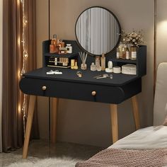 a black vanity table with mirror and cosmetics on it