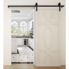 an open door leading to a white kitchen