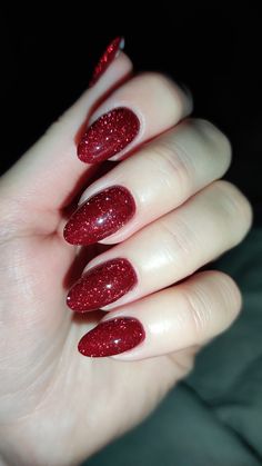 #rednails #nails #nailart #naildesign #red #glitternails #glitter #sparklenails #gelnails #gelpolish #nailinspiration Red Wine Glitter Nails, Glittery Red Nails Christmas, Red Acrylic Nails Almond Glitter, Bright Red Sparkly Nails, Cranberry Sparkle Nails, Glittery Burgundy Nails, Red Nails With Red Glitter, Dark Red Nails With Design Glitter, Deep Red Nails With Glitter