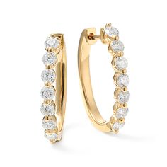 A minimal yet secure single-prong setting showcases the gorgeous round shape and superior sparkle and fire of the natural diamonds in these oval hoop earrings. Crafted in warm 14-karat yellow gold  a hinge back keeps these beauties secure. Timeless Oval Yellow Gold Diamond Earrings, Diamond White Oval Hoop Earrings With Prong Setting, Oval Diamond Hoop Earrings With Diamond Accents, Oval Diamond Hoop Earrings With Accents, Oval Fine Jewelry Diamond Earrings With Single Cut Diamonds, Oval Diamond Hoop Earrings With Prong Setting, Oval Single Cut Diamond Earrings, Timeless Oval Hoop Earrings For Anniversary, Modern Oval Brilliant Cut Diamond Earrings