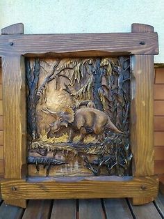 a wooden frame with an animal scene on it