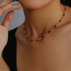 Experience the exquisite beauty of our handcrafted Black Spinel Gold Bean Mini Bead Necklace. Each element is carefully handcrafted to create a refined, elegant look. Add a touch of sophistication to any outfit with this versatile and glamorous necklace. Metal: 18ct Recycled Gold Plated On Brass Gemstone:Black Spinel Pearl: Freshwater Pearl 2.5mm Length: 400-450mm Weight: 5g Black Spinel Necklace, Gold Beaded Necklace, Gemstone Beaded Necklace, Gold Bead Necklace, Chanel Earrings, Black Spinel, Unique Gemstones, 925 Silver Jewelry, Swarovski Pearls