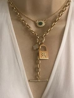 This personalized necklace features a gold plated stainless steel padlock with your choice of one initial in CZ old English font(choose at the checkout). Mother of pearl clover and CZ toggle chain drop add a modern twist to this necklace. Oval link chain is gold plated over stainless steel. Drop toggle length is approximately 3 inches. Necklace length is adjustable 16-18 inches.  🎁All orders are shipped in a box. Gift messages are attached to the box. Elegant Gold Plated Toggle Pendant Necklace, Elegant Gold-plated Pendant Toggle Necklace, Elegant Gold Plated Pendant Toggle Necklace, Timeless Gold Necklace With Toggle Clasp, Elegant Chain Link Charm Necklaces As A Gift, Luxury Chain Link Jewelry With Toggle Clasp, Luxury Chain Necklace With Toggle Clasp As Gift, Luxury Gold Necklaces With Toggle Clasp, Luxury Gold Chain Necklace With Toggle Clasp