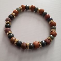 Cena Bead Bracelets Brown Crystal Bracelet With Faceted Round Beads, Adjustable Brown Stretch Bracelet With Faceted Beads, Brown Stretch Bracelet With Faceted Beads, Adjustable, Colorful Beaded Bracelets With Round Beads, Everyday Brown Bracelets With Colorful Beads, Adjustable Brown Stretch Bracelet With Colorful Beads, Brown Beaded Bracelets With Large Beads For Casual Wear, Casual Brown Beaded Bracelets With Large Beads, Orange Bracelets With Wooden Round Beads