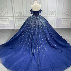 a blue ball gown with sequins on it