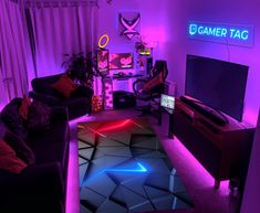 a living room filled with furniture and neon lights