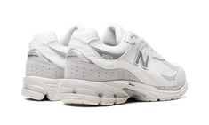 The New Balance 2002R Gore-Tex "White/Grey" is a version of the retro running and lifestyle sneaker with a water-resistant build.  Debuted in 2010, the New Balance 2002R returned a decade later to much fanfare.  Here, the shoe is updated with a water-resistant Gore-Tex shell that keeps water from penetrating the wearer’s foot in inclement weather conditions.  The upper features a white mesh base and white and grey leather overlays.  A reflective silver “N” logo can be found on both sides of the shoe.  Underfoot, the 2002R is equipped with the New Balance’s ABZORB cushioning for soft comfort and Stability Web system for support.  Release date: September 22, 2023 Gore Tex Shoes, New Balance 2002r, N Logo, Stadium Goods, September 22, White Mesh, Grey Leather, Gore Tex, Weather Conditions