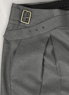 These men's customized grey wool Gurkha pants combine classic elegance with modern functionality, making them a versatile choice for any wardrobe. Featuring an adjustable buckle front and deep pleats, they offer both comfort and style, ideal for business, office, or formal occasions. Crafted from high-quality wool, these pants provide warmth and durability while maintaining a refined, tailored look. The unique Gurkha design, inspired by military heritage, adds a touch of sophistication, making t Gurkha Pants, Formal Pant, Dapper Suits, Pants Gift, Business Pants, Custom Made Clothing, Bespoke Tailoring, Mens Pants Fashion, Trouser Style