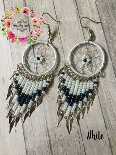 Visit my Store for more beautiful Jewelry ----- https://www.etsy.com/shop/HoneyRossJewelry This beautiful set of dreamcatcher is made with much love in Peru, has several processes of preparation, from the making of the ring made of wire and thread, then the fabric inside the ring with silver thread with small crystals, and finally the preparation of the beads made with alpaca wire and beads. ------Product characteristics----- ☼The ring of the earring and necklace is the size of a 1 dollar coin. ☼The approximate measurement is 3 inches ☼Length of the necklace: 9 inches I'm sure that you will love these beautiful earrings and necklace. Both will reach your hands in a nice bag of organza and carefully packaged. ♥ A dream catcher is an article made by hand, whose base is a ring made of alpaca Silver Chandelier Earrings With Colorful Beads As Gift, White Wire Wrapped Dangle Beaded Earrings, Nickel-free White Bohemian Chandelier Earrings, White Bohemian Nickel-free Chandelier Earrings, Bohemian White Nickel-free Chandelier Earrings, Handmade Dream Catcher, Dreamcatcher Earrings, Mothers Day Gift Ideas, Small Crystals