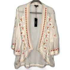 Tolani White Embroidered Open Front Karma Kimono Jacket Size: L Brand New With Tags! Retail Price $173 Please Zoom In Photos For Best View. Open Front. Stunning Embroidery. 100% Viscose. Hand Wash/Dry Clean. Measurements (Laid Flat Unstretched) Chest (Under Arm To Under Arm) 23”Flat Across Waist: 23”Flat Across Sleeve Length: 18” Sleeve Width: 8.5”Flat Across Bicep Total Length (Top Shoulder To Hem) Front 27”, Back Length 30.5” Back (Shoulder Blade Seam To Shoulder Blade Seam) 16.5” Flat Across Fitted White Cardigan With Floral Embroidery, White Open Front Kimono For Spring, Fitted Embroidered Summer Kimono, Fitted Summer Embroidered Kimono, Fitted Summer Kimono With Embroidery, Summer Festive Embroidered Kimono, Festive White Outerwear With Intricate Embroidery, Bohemian Kimono With Chikankari Embroidery For Spring, Bohemian Chikankari Embroidered Kimono For Spring