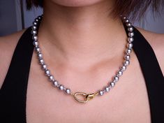 This Swarovski Grey Pearl Necklace features elegant 8mm Swarovski crystal pearls, perfect for bridesmaids or as a gift for her. A timeless pearl design, ideal for bridal jewelry, evening wear, or formal occasions. ☘️ Necklace length: 18 inches ☘️ Other Considerations: - Comfort Assured: My handmade jewelry is nickel-free and hypoallergenic, making it safe and comfortable for all skin types. - Worry-Free Returns: If you're not satisfied for any reason, I offer a 14-day return policy, and you can Grey Pearl Necklace, Necklace Swarovski, Pearl Design, Wedding Jewellery Necklace, Faux Pearl Necklace, Pearl Grey, Crystal Pearls, Wedding Necklace, Bridesmaid Gift