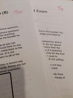 two papers with writing on them sitting next to each other