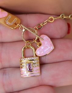 "OMG this is the cutest toggle front choker necklace ever! This lovely chain choker is made of 18k gold filled oval medium size long and short links measure 8x4mm. Toggle sits in front. The \"I Love U\" plaque, lock pendant and heart charm are all heavily 18k gold plated with crystals and pink enamel that make it stand out! I personally love this necklace! Model is wearing a 15\" length. This necklace comes in many lengths please choose your desired length. Best to measure your neck if you not s Trendy Toggle Necklace With Lobster Clasp As Gift, Gold Toggle Necklace With Charms As Gift, Gift Toggle Necklace With Adjustable Chain, Valentine's Day Gift Toggle Necklace With Lobster Clasp, Valentine's Day Jewelry Gift With Toggle Clasp, Valentine's Day Gift Jewelry With Toggle Clasp, Heart Pendant Jewelry With Toggle Clasp As Gift, Heart Charm Toggle Necklace For Valentine's Day Gift, Gold Toggle Necklace For Valentine's Day