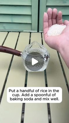 someone is holding out their hand with rice in it