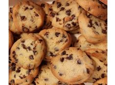 a box full of chocolate chip cookies sitting on top of a table