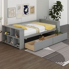 a bed sitting in a bedroom next to a dresser and rug on top of a hard wood floor