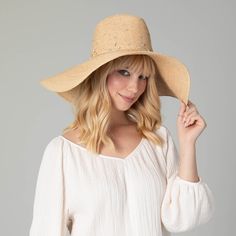 Our Glitz Wide Brim Fedora Sun Hat is a luxurious accessory for your summertime wardrobe. The delicate braid raffia is carefully crafted with attention to detail, and embedded with rhinestones to add a touch of sparkle. The 6" brim offers UPF 50+ sun protection and is adjustable for a perfect fit. Boasting a classic natural color and crafted from 100% premium raffia, this floppy fedora is a must-have for any fashionable collection. Features: Color: NaturalMaterials: 100% RaffiaBrim Size: 6" Brim Elegant Braided Hat For The Beach, Elegant Braided Hat For Beach, Elegant Braided Brimmed Straw Hat, Elegant Braided Straw Hat With Flat Brim, Elegant Vacation Hat, Elegant Rhinestone Hat For Spring, Elegant Braided Toquilla Straw Hat, Elegant Braided Sun Hat For The Beach, Elegant Braided Sun Hat For Beach