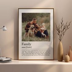 a family photo on a shelf next to a vase with flowers and a plant in it