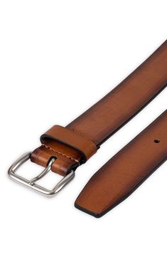 Burnished edges adds a rustic appeal to a stylish leather belt fitted with a soft rounded buckle for a casual finish. 1 1/2" belt width Leather Imported Rustic Leather Belt Buckle With Removable Belt, Rustic Leather Belt With Antique Buckle, Casual Leather Belts And Suspenders, Casual Leather Belts For Business, Casual Leather Belt For Business, Rugged Leather Belt With Removable Feature, Distressed Brown Leather Belt With Antique Buckle, Classic Distressed Brown Belt With Antique Buckle, Casual Leather Belt Buckles With Antique Buckle