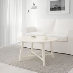 a white couch and table in a room