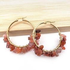 LOVCIA Natural Stone Beaded Boho Chic Gold Plated Large Hoop Earrings for Women Elevate your style with the LOVCIA Natural Stone Beaded Boho Chic Gold Plated Large Hoop Earrings. These stunning earrings are a perfect blend of elegance and bohemian flair, designed to make a statement wherever you go. Key Features: Beaded Hoop Design: Each earring showcases a unique pattern of natural stone beads intricately wrapped around gold-tone hoops, creating a bold and vibrant look. Variety of Colors: Avail Adjustable Hoop Earrings With Natural Stones, Gemstone Beads Hoop Earrings Gift, Bohemian Hoop Earrings With Natural Stones, Black Friday Jewelry, Mens Stainless Steel Rings, Jewelry Organizer Storage, Natural Stone Beads, Hoop Design, Natural Stone Bracelets