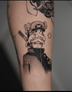 a man with a pirate tattoo on his arm holding a baseball bat and wearing a hat